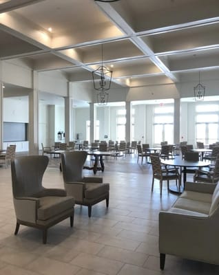 Bright dining room with ample seating and decor