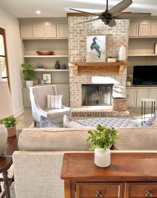 Cozy living room with a fireplace and artwork
