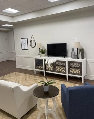 Cozy common area with seating and a TV