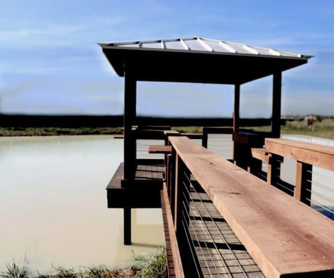 Lake gazebo overlooking a serene pond