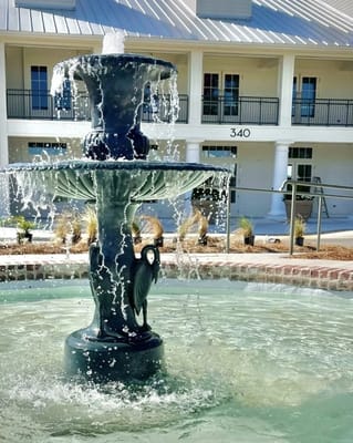A decorative fountain in a garden area