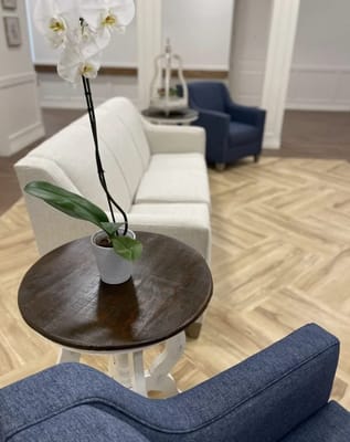 Cozy common area with seating and plant decor