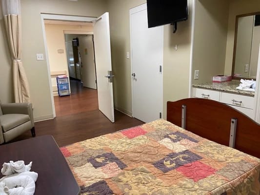 Bright private resident room with bedside table