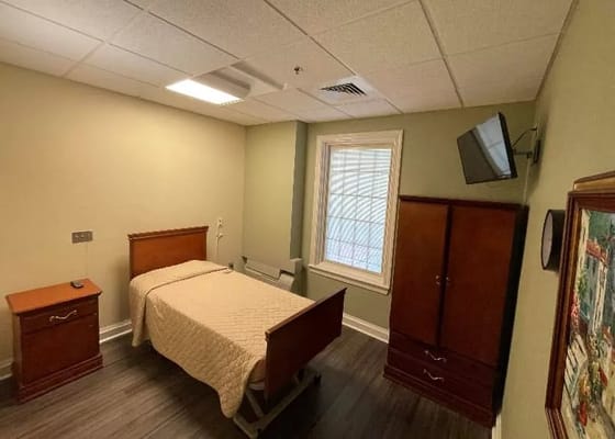 Private resident room with bed and furnishings