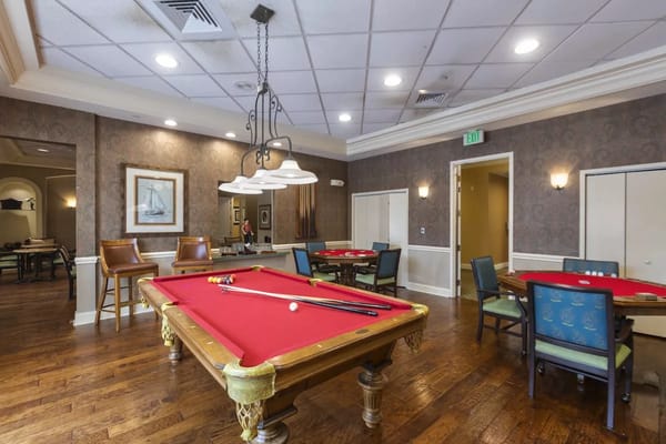 Bright billiards room with a pool table