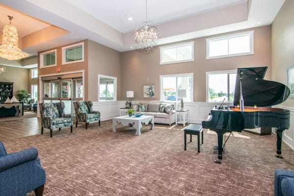 Bright interior lounge area with a grand piano