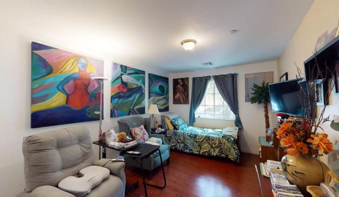 Cozy resident room with vibrant art and furniture