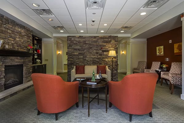 Cozy common area with seating and a fireplace