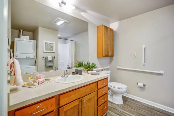 A well-lit bathroom in a senior living facility
