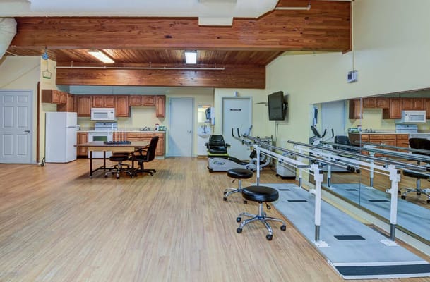 Rehabilitation room with equipment and seating