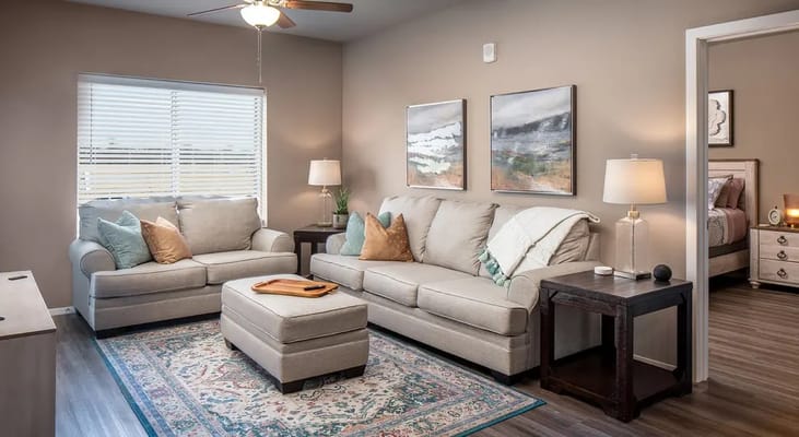 Cozy living room with comfortable furniture and artwork