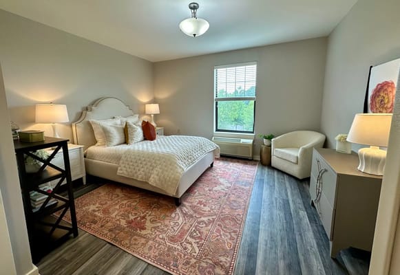 A well-furnished private resident room with decorative elements
