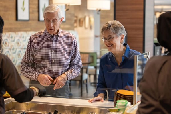 Residents enjoying a meal at the dining area