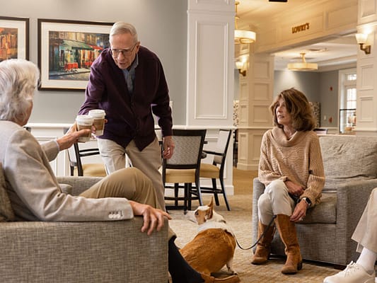 Residents enjoying coffee in a lounge area