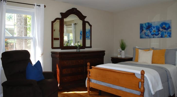 Private resident room with a bed and dresser