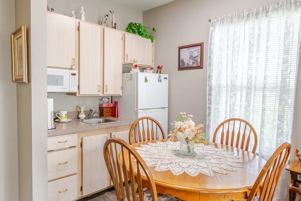 Cozy dining area with wooden table and chairs