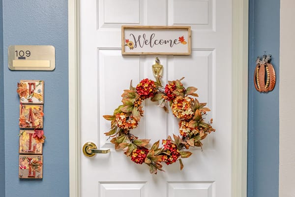 Decorative welcome wreath on a resident door