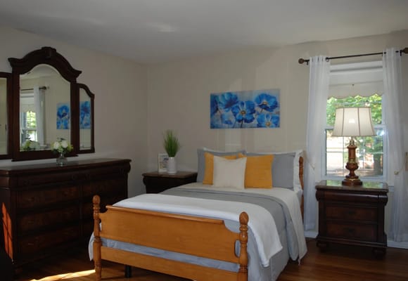 Cozy and inviting resident room with floral decor