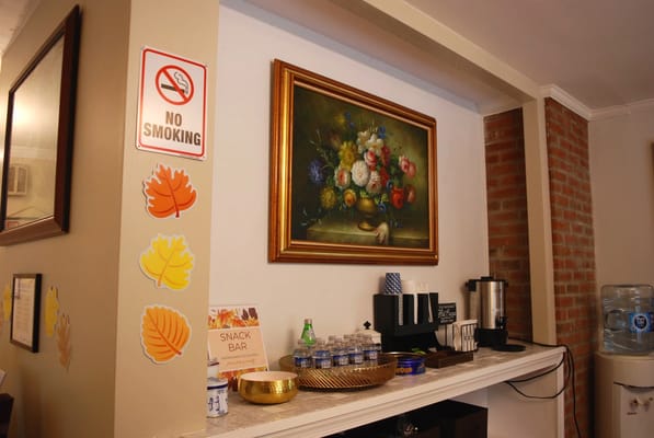 Interior view of a common area with artwork and refreshments