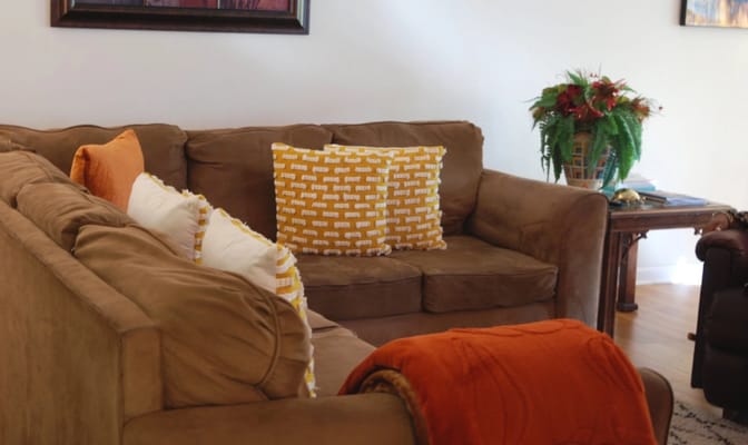 Cozy common area with a couch and decorative pillows