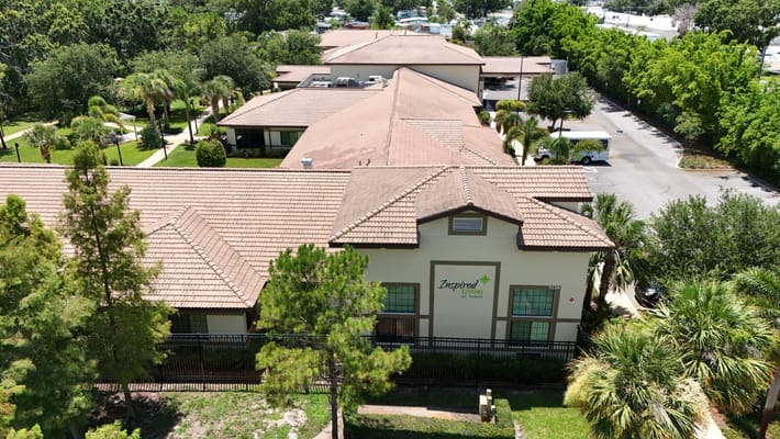 Aerial view of Inspired Living Tampa with landscaped grounds.