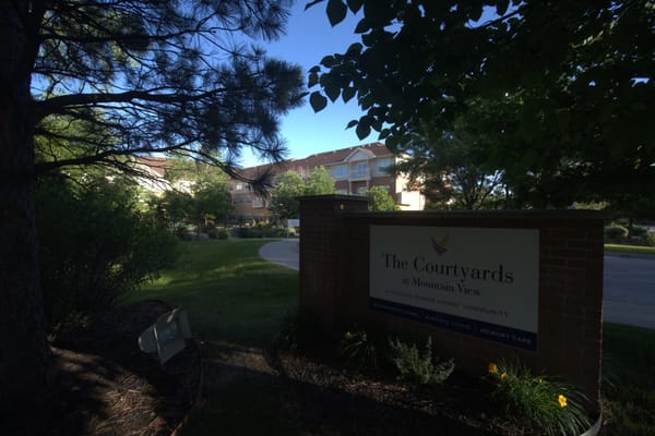 Sign for The Courtyards at Mountain View senior living facility