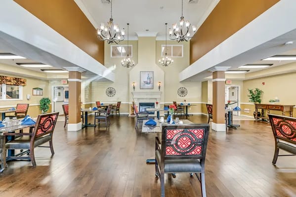 Elegant dining room with tables and chandelier lighting