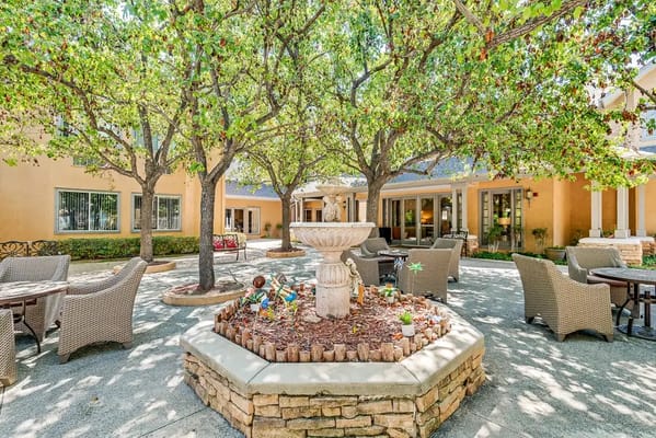 Beautiful outdoor courtyard with seating and trees