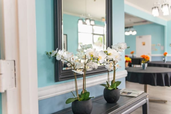 Bright interior view with flower arrangements