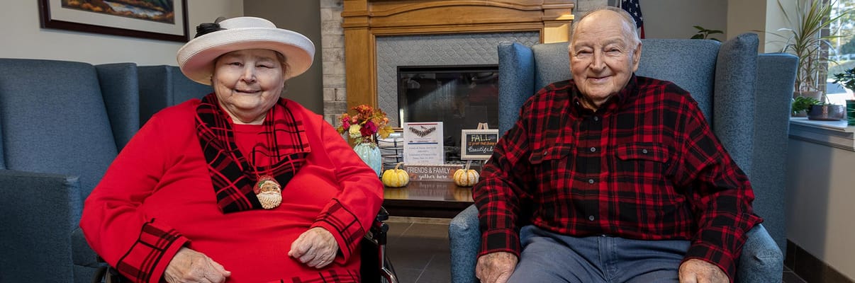 Two residents sitting in a common area
