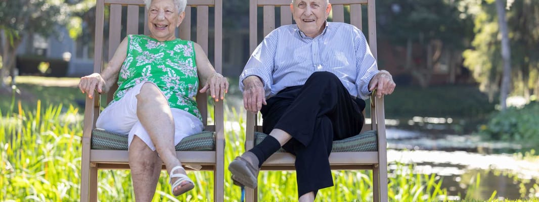 Two seniors enjoying the outdoor space
