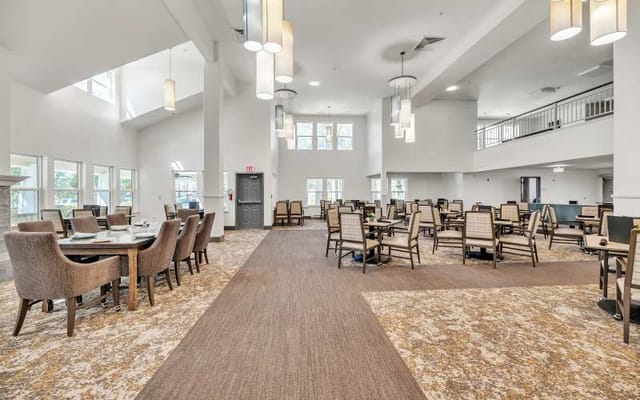 Bright dining room with chairs and tables arranged