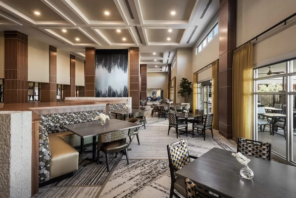 Bright dining area with modern decor and seating