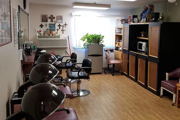 Interior of the hair salon with styling chairs and equipment