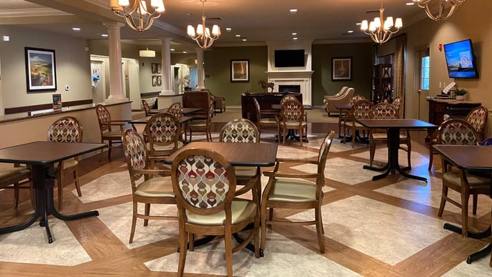 Bright common area with tables and chairs
