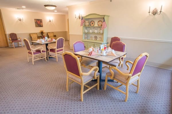 Bright dining area with tables set for a meal