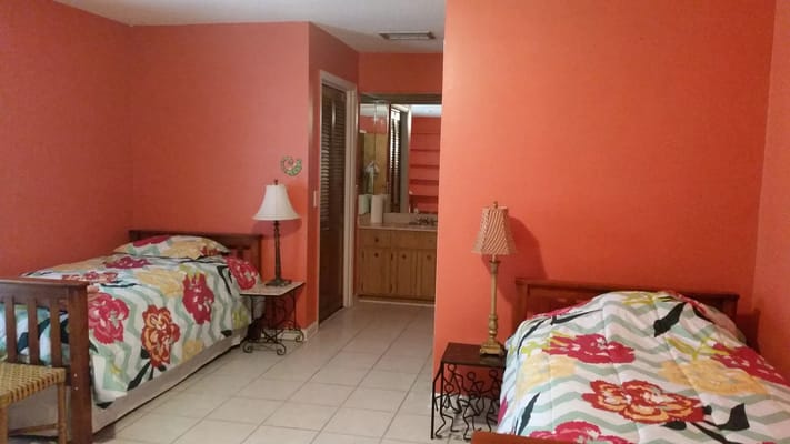 Brightly colored shared resident room with two beds