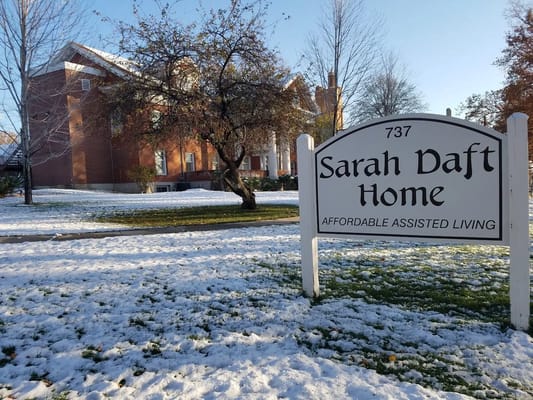 Sign of Sarah Daft Home with building in background