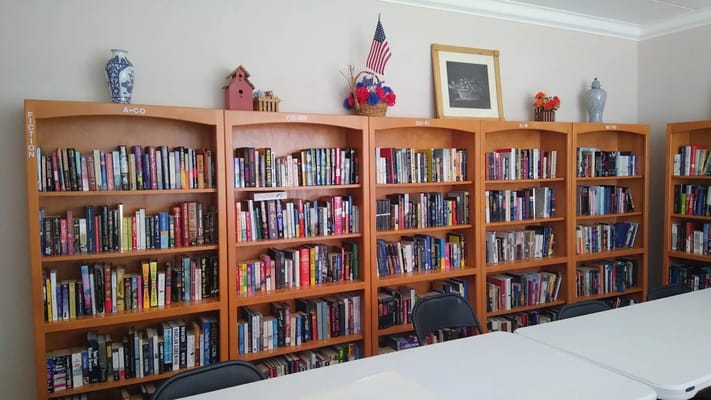 Bookshelves filled with a variety of books in a library setting