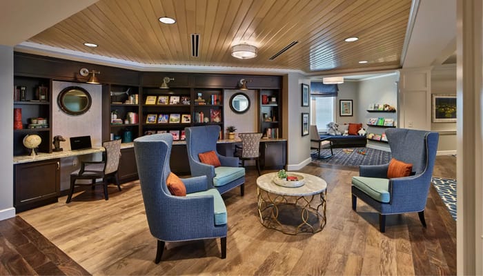 Cozy lounge with comfortable seating and bookshelves