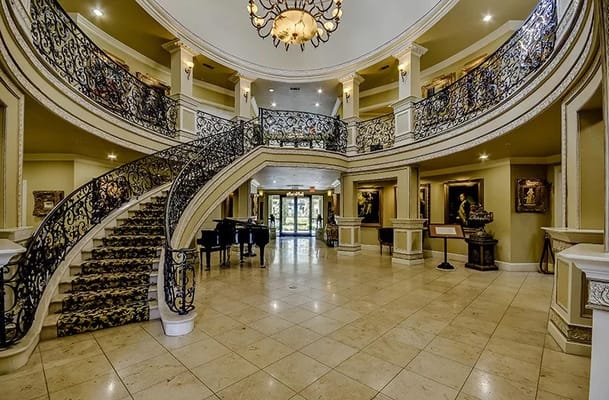 Elegant lobby with a grand staircase and decorative features