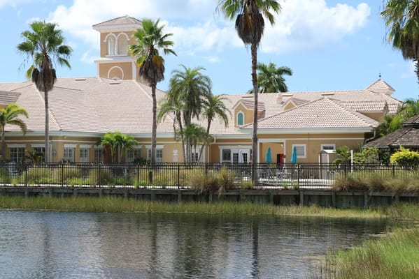 Exterior view of a senior living facility by the water