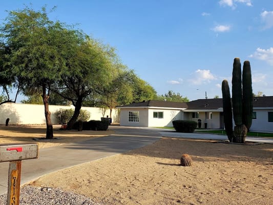 Exterior view of the facility with landscaping