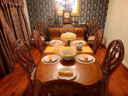 Elegant dining table set with flowers and decor