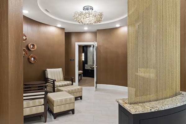 Warmly decorated entry lounge with seating area and decorative lighting