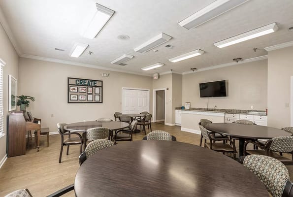 Bright community room with tables and chairs