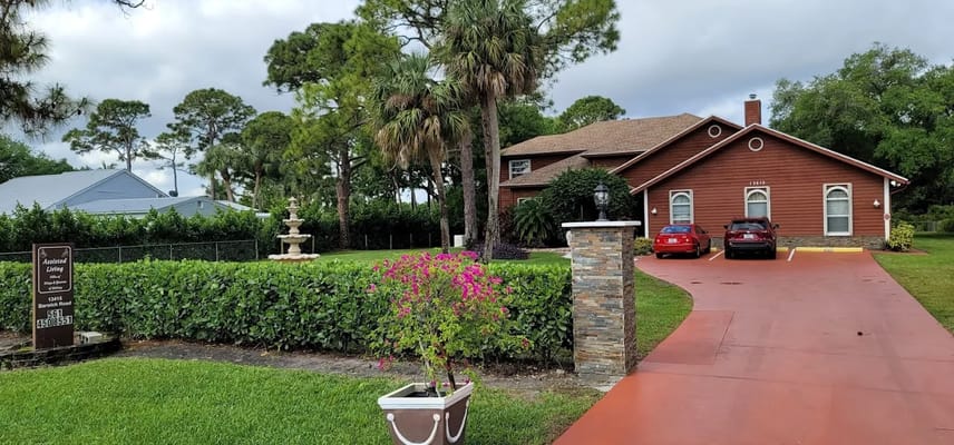Exterior view of the Villa of Delray with landscaped entrance