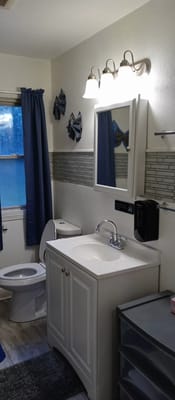 Brightly lit bathroom with modern fixtures