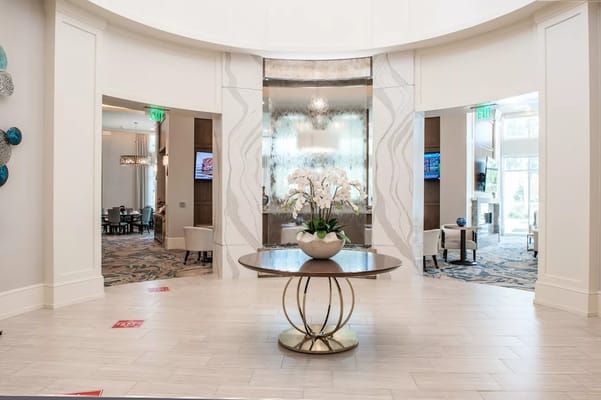 Interior view of a lobby with decorative plants