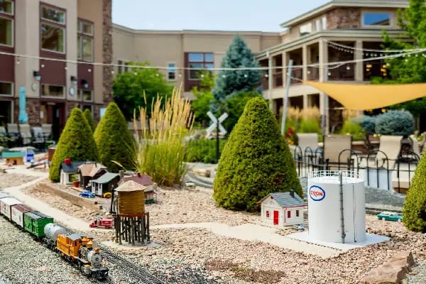 Outdoor garden area with miniature train set